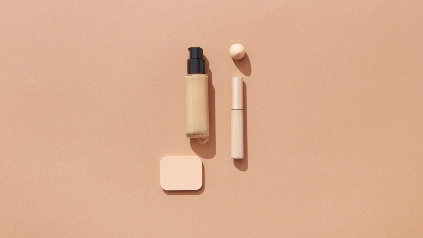 Flat lay of the best dewy foundation for glowing skin