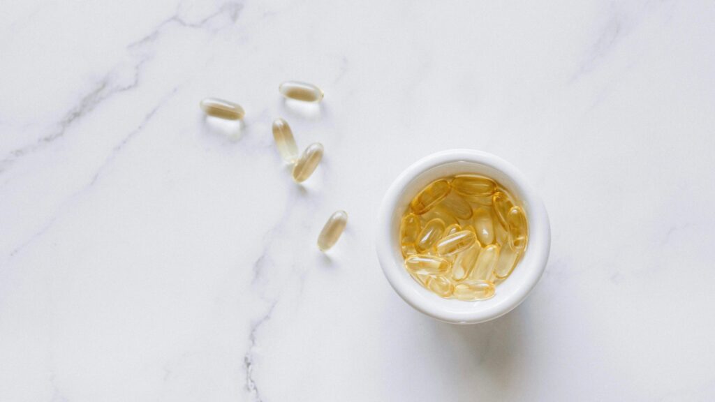 Supplements on marble—symbolizing daily beauty supplements that actually work.