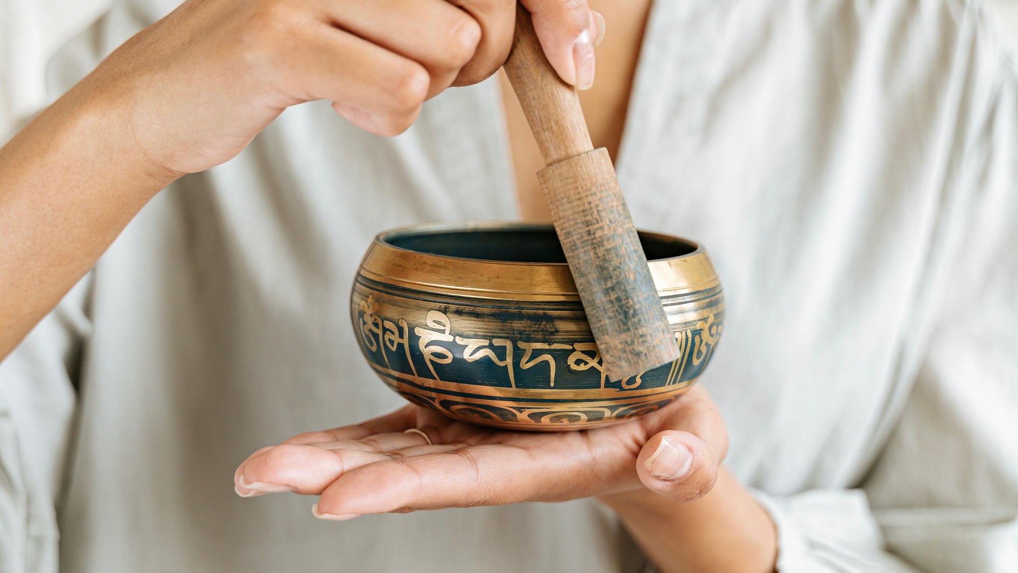 Close-up of a golden sound bowl, symbolizing wellness tools for mood and energy