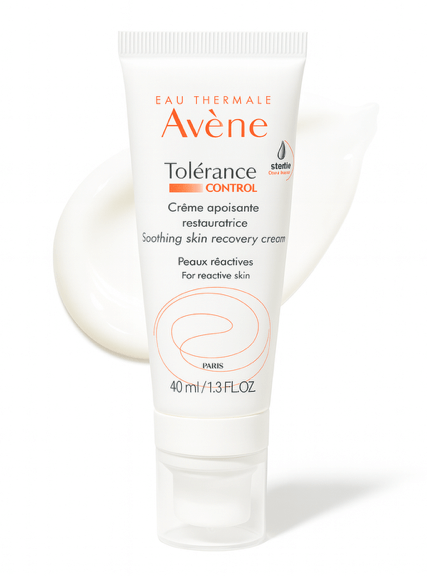 Avene Tolerance cream moisturizer bottle on white background and product smear behind.