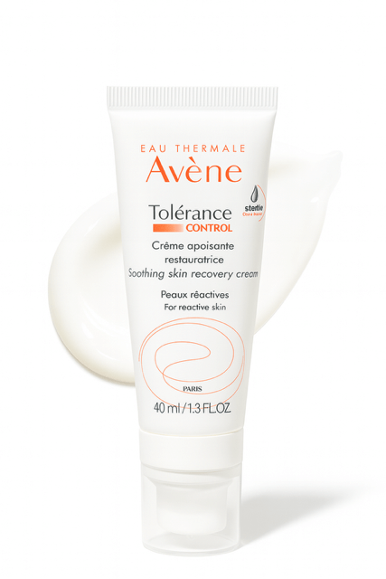 Avene Tolerance cream moisturizer bottle on white background and product smear behind.