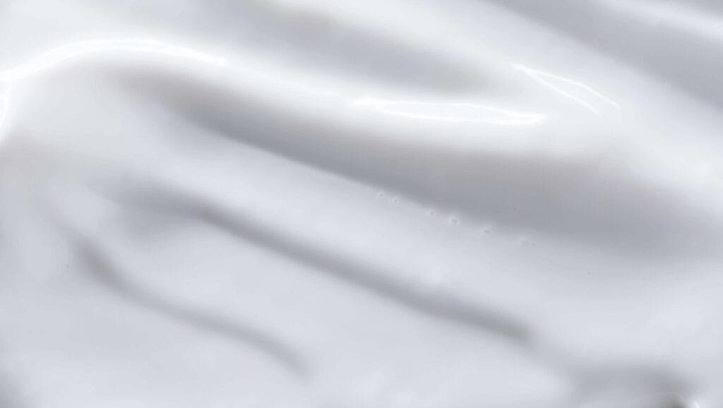 White cream smear closeup representing ceramides in skincare routine