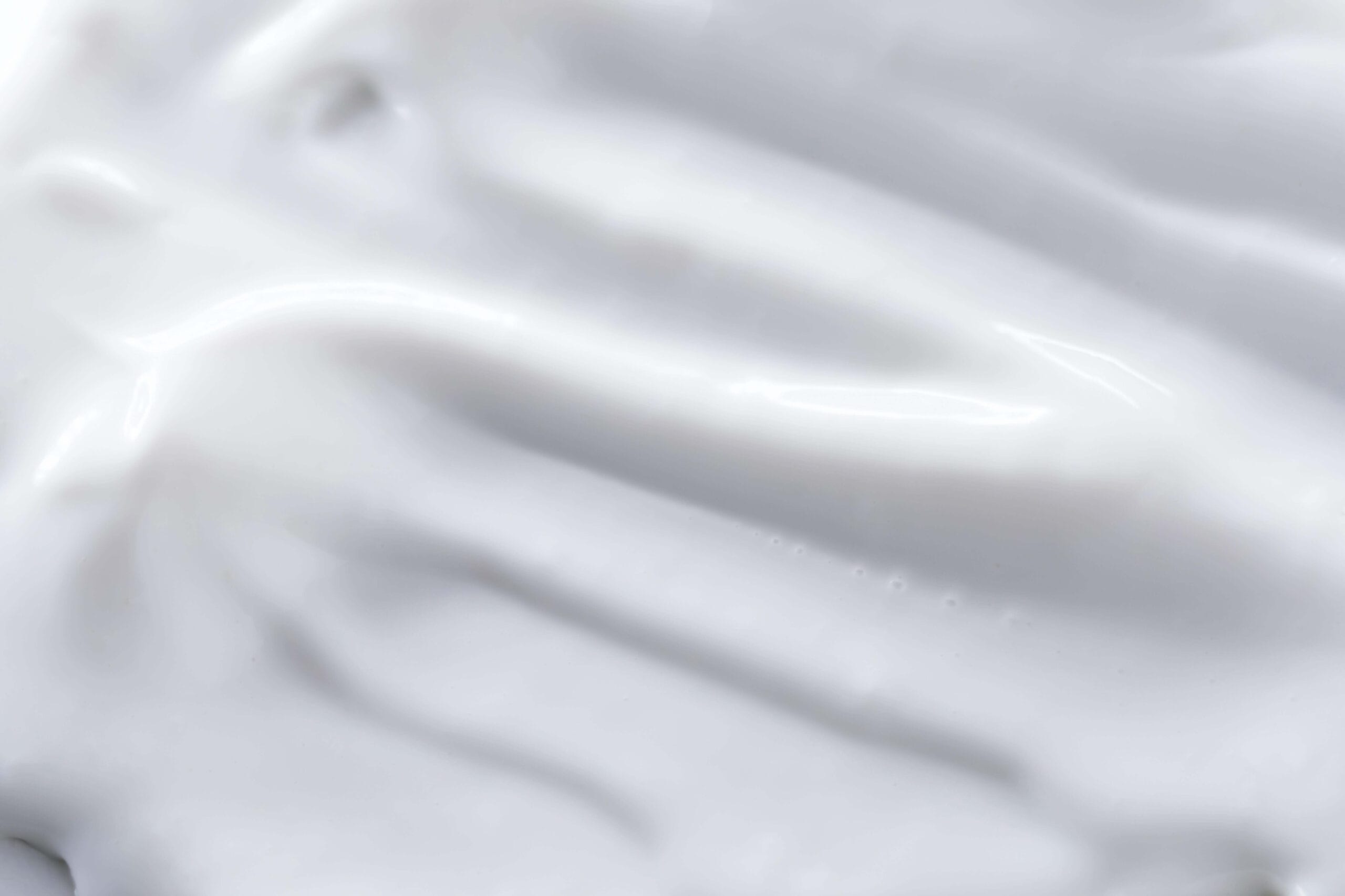 White cream smear closeup representing ceramides in skincare routine
