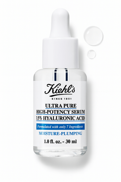 Kiehl's Ultra Pure hyaluronic serum bottle with water droplets behind on a white background.