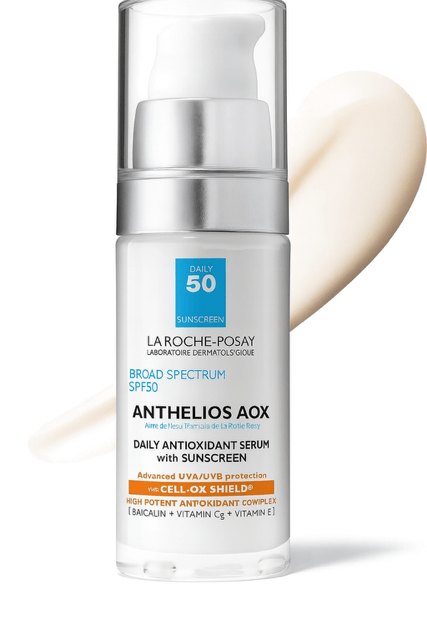 La Roche Posay Anthelios sunscreen bottle on white background and product smear behind.