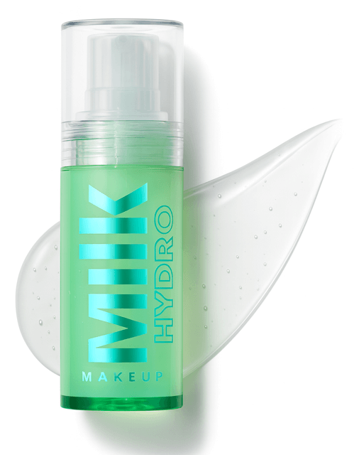 Milk Makeup Best Dewy Primer green bottle on white background and gel product smear behind.