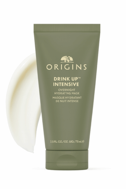 Origins overnight masks for glowing skin product image of green tube with adjacent product smear.