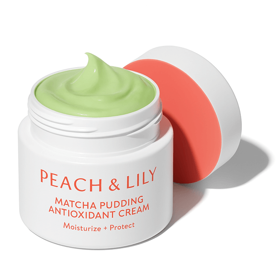 Peach & Lily cream moisturizer jar on white background and light green product visible on top and a nearby lid.