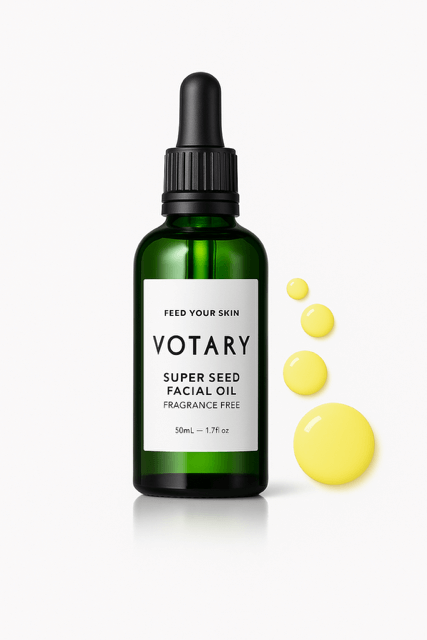 Votary Face dark green bottle with golden oil drops -- part of Best Face Oil for Changing Seasons.
