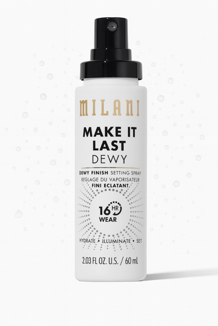 Milani Make It Dewy Setting Spray in a white bottle and dew drops behind.