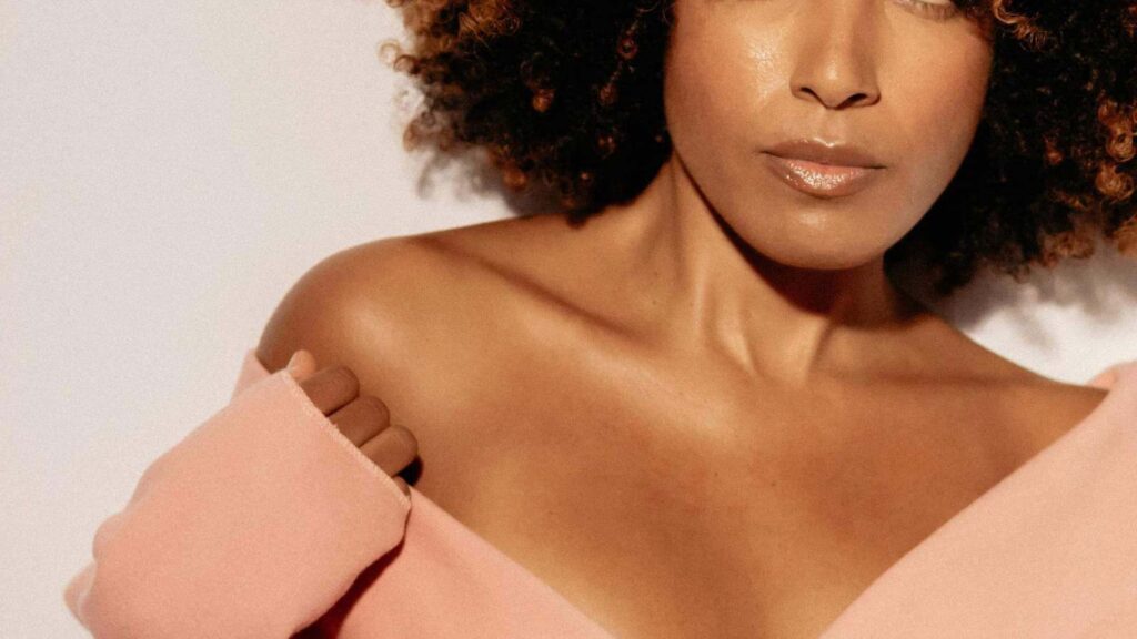 Woman's face and neck close up demonstrating soft sculpting for glowing skin.