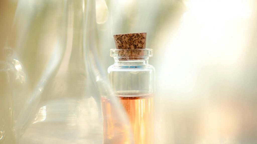 Oil in glass bottle representing best glow-boosting face oils that don't feel heavy.