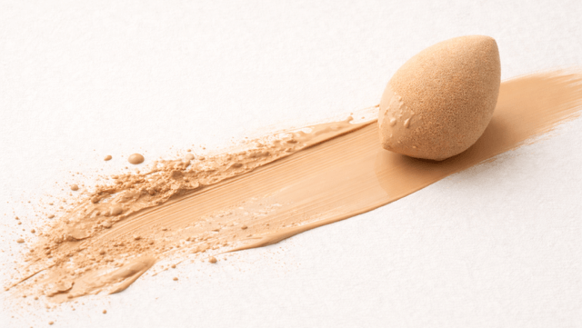 How to Fix Separating Foundation represented by smeared liquid foundation and sponge.