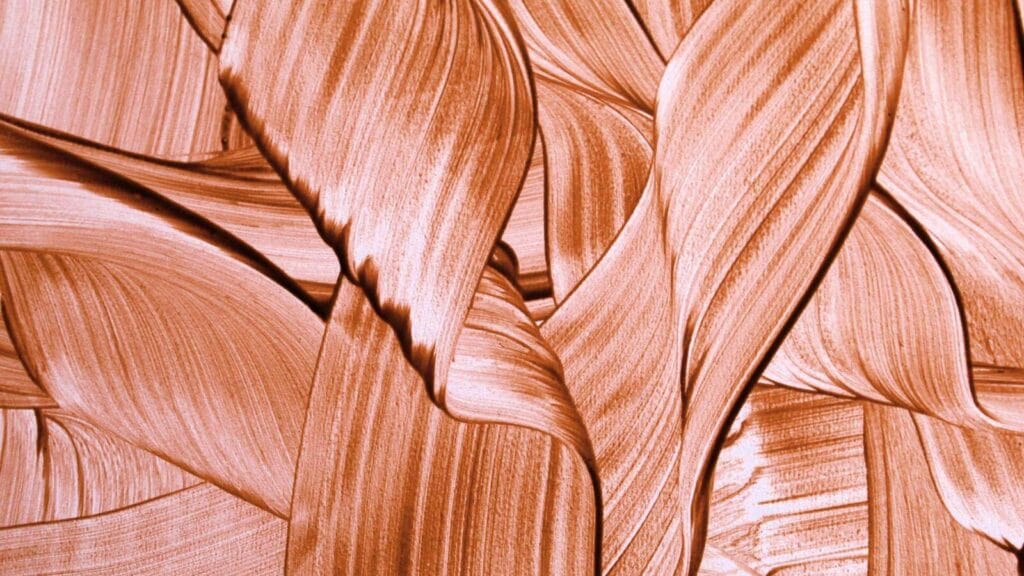 Best liquid highlighters that melt into the skin illustrating by overlapping reflective gold ribbons.