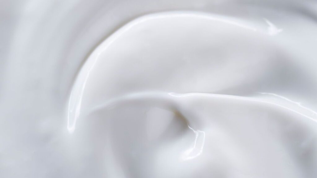 A silky cream texture close up, representing most luxe night creams for glowing skin.